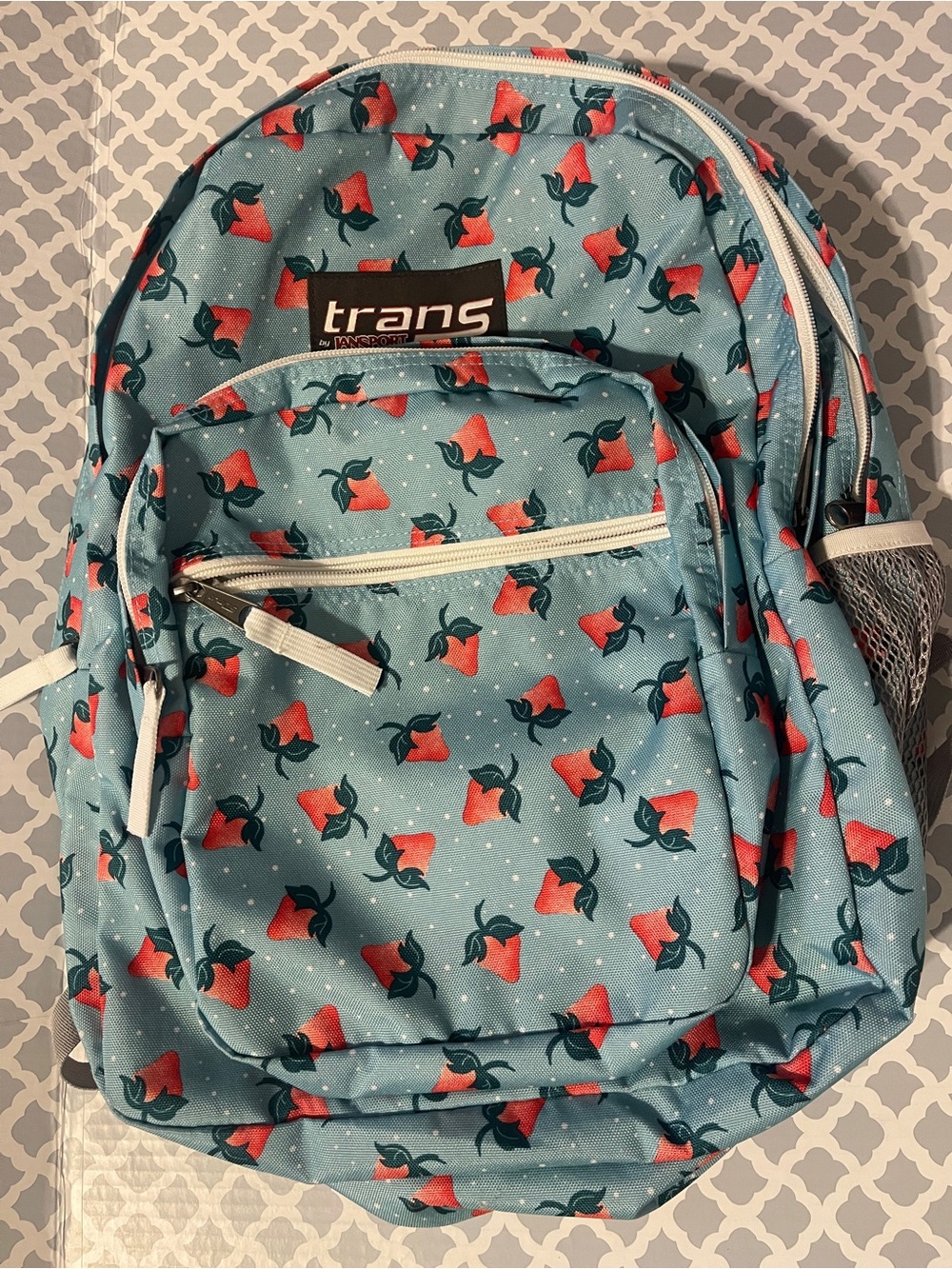 Trans by Jansport Teal Strawberry and  Polkadot print Backpack